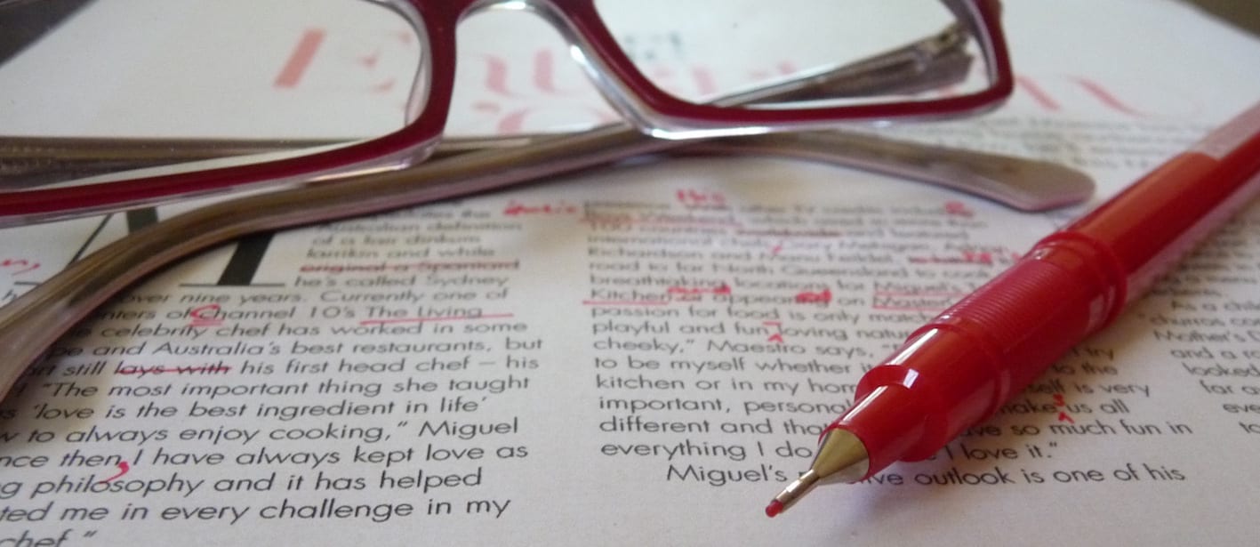 Proofreader red pen on copy